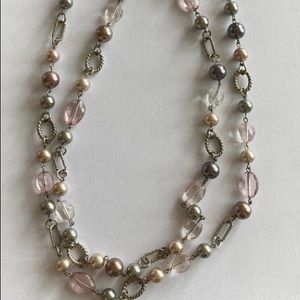 Fashion necklace with beads and faux stones. Pastel pink and silver colors.